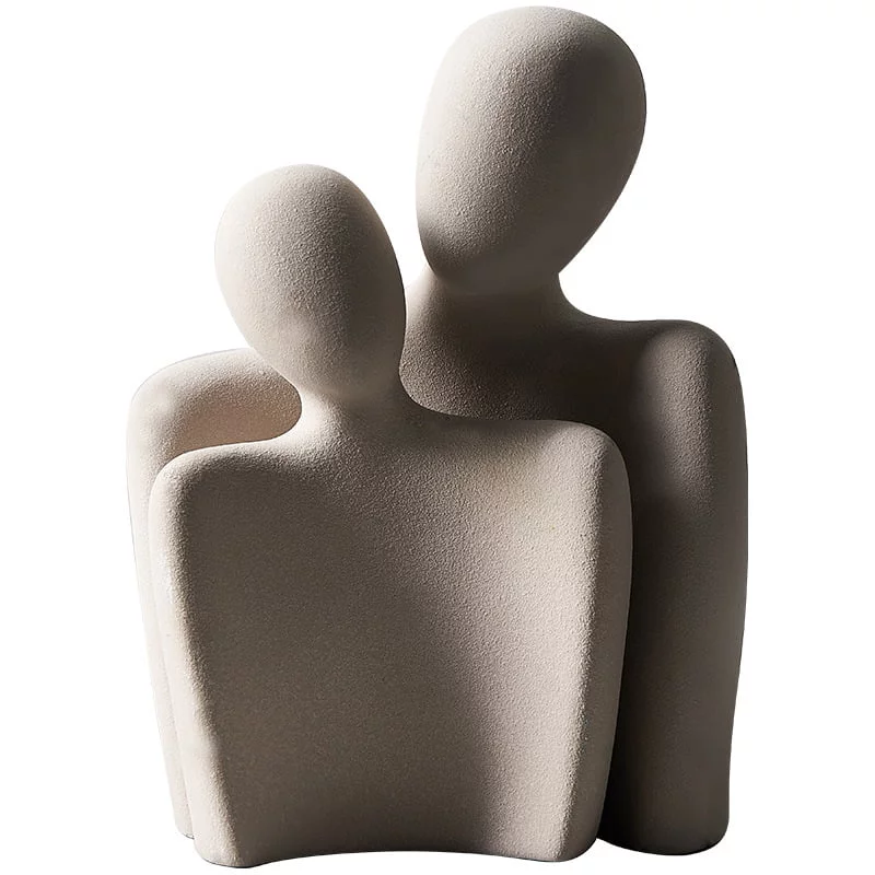 Thanksgiving hostess gift ideas: grey abstract two-figure sculpture on a white background