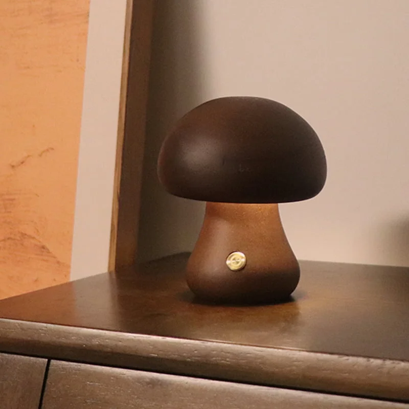 Wooden mushroom night light glowing on a dresser